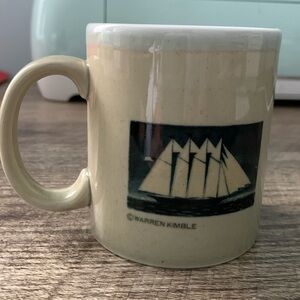 a vintage coffee mug featuring American folk art.